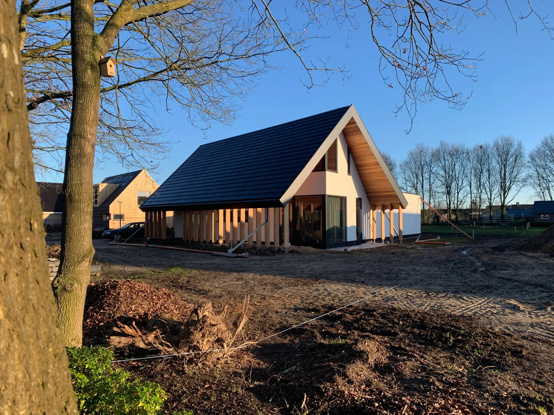Pitched-roof residential exterior during site finishing.