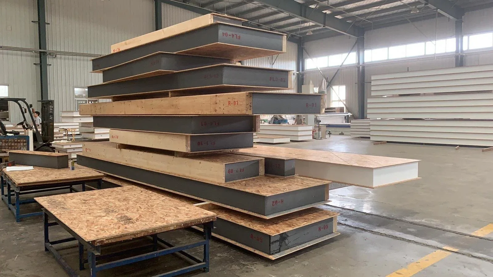 Prepared SIP elements stacked in a production space.