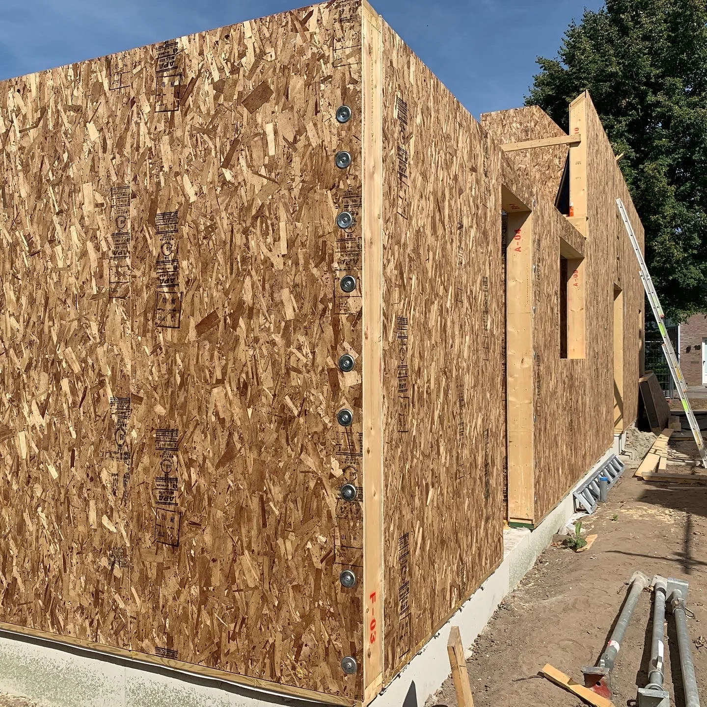 OSB-faced wall panels and an opening during construction