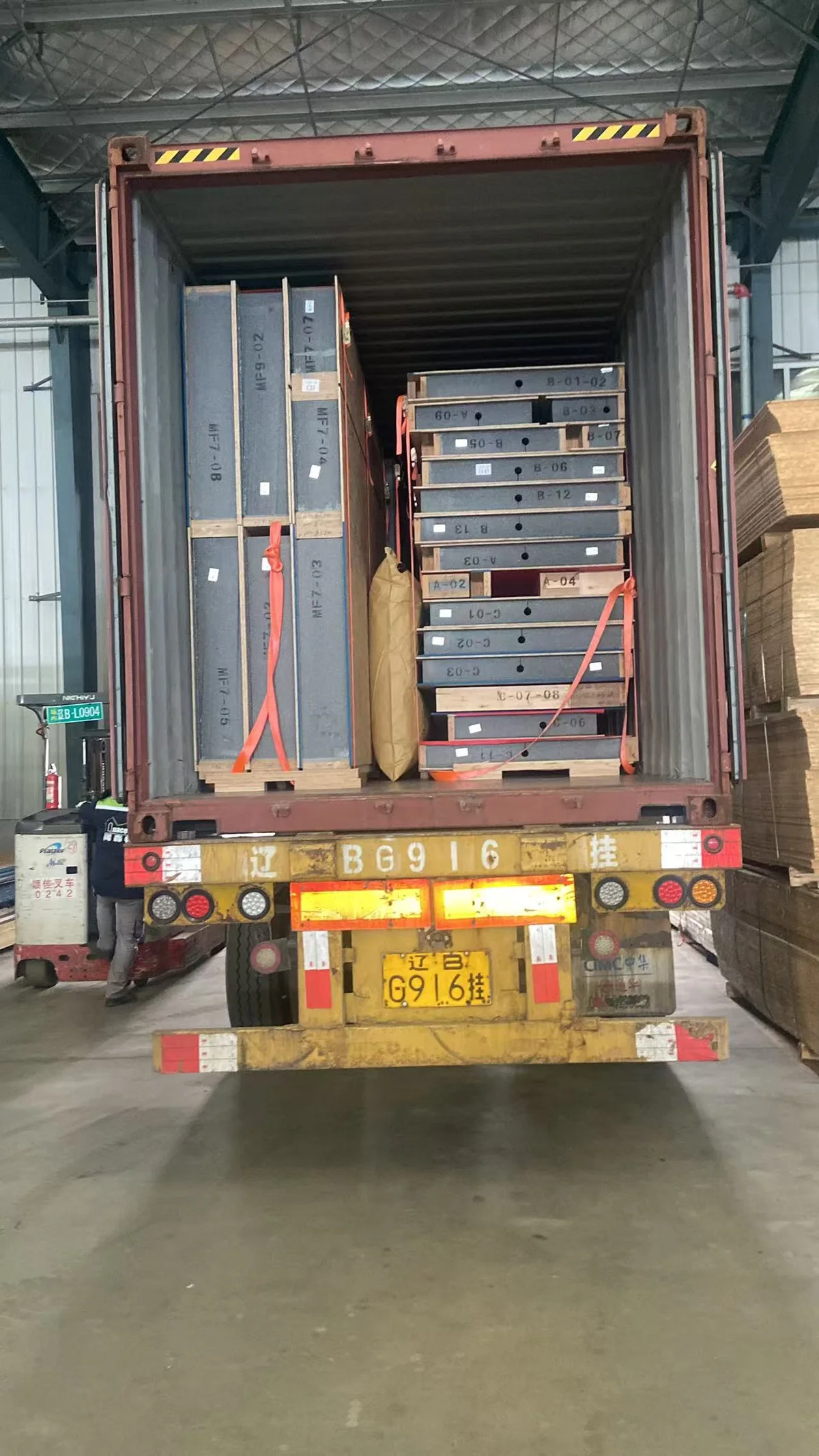 SIP panel packages loaded inside an open shipping container.