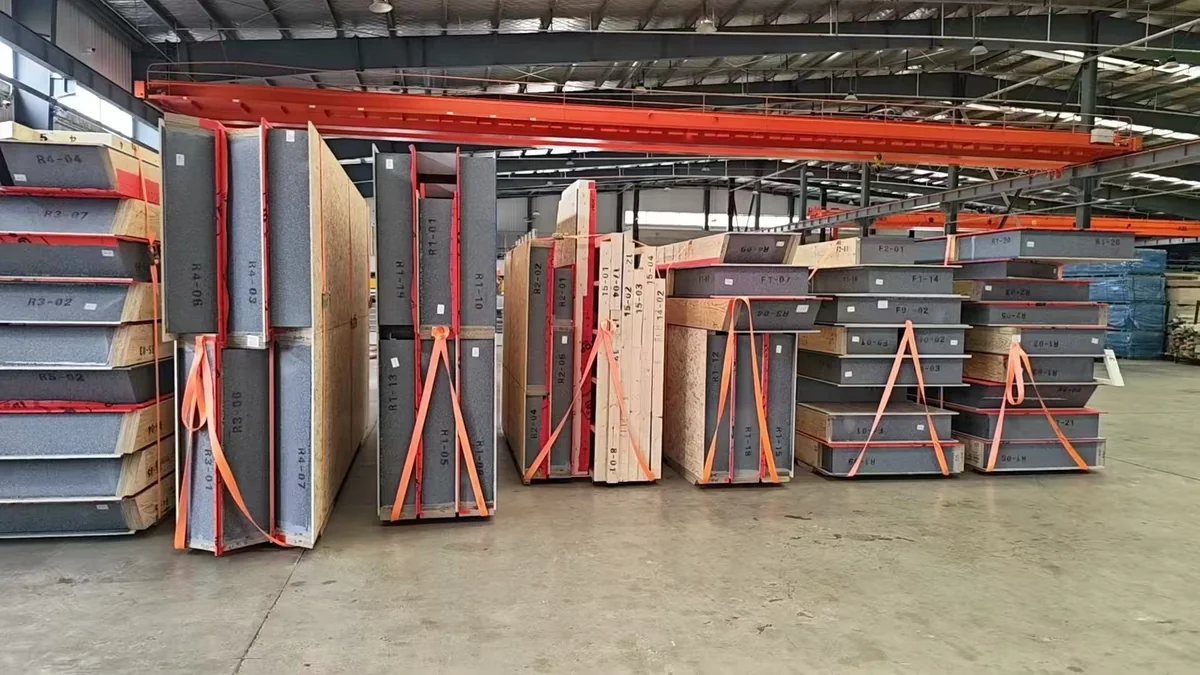 SIP panel packages held in transport frames in the factory.